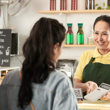 Barista Showing Price of Order