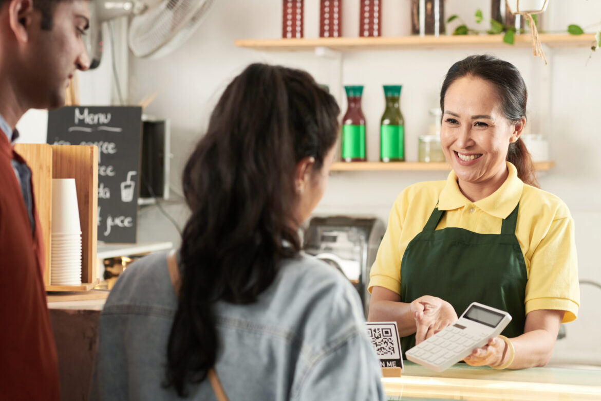 Barista Showing Price of Order