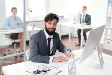 Hipster Businessman Posing at Workplace