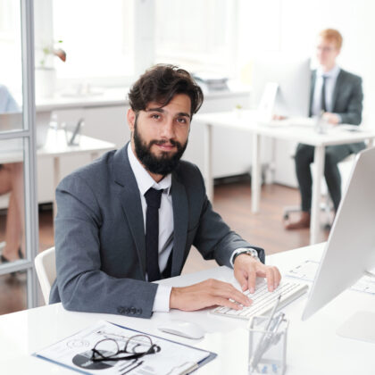 Hipster Businessman Posing at Workplace