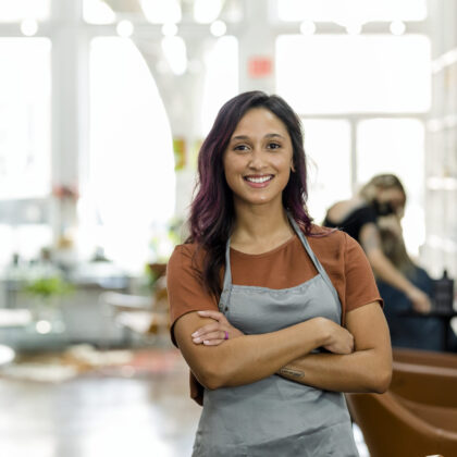 Smiling small beauty salon owner